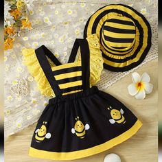 Adorable Girls Bumble Bee Dress With Matching Hat. Black Pinafore Dress With Yellow Lace And Cute Bumblebees On The Skirt. Sz 12-24 Months Bumble Bee Dress, Black Pinafore, Bee Dress, Girl Onesies, Toddler Girl Dresses, Romper Dress, Sleeved Romper, Toddler Girl Outfits, Lovely Dresses