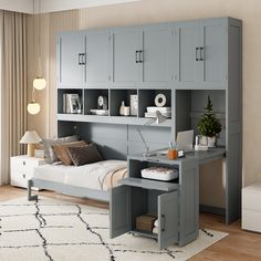 a bedroom with a bed, desk and cabinets