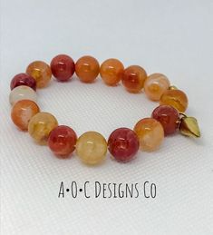 10mm round orange crab fire agate beads Gold plated charm Yellow Mermaid, Orange Jewelry, Bethlehem Pa, Orange Agate, Grey Agate, Chunky Bracelets, Fire Agate, Agate Jewelry, Gemstone Beaded Bracelets