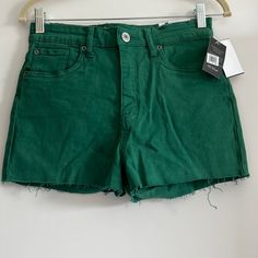 -High Rise -Unfinished Hem Material: 98% Cotton. 2% Spandex Green Stretch Jean Shorts, Green Denim Jean Shorts For Spring, Trendy Green Stretch Jean Shorts, Spring Green Denim Jean Shorts, Green Summer Jeans, Trendy Green Cutoff Shorts, Casual Stretch Green Jean Shorts, Green High-waisted Jean Shorts For Spring, Spring Green High-waisted Jean Shorts