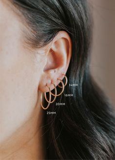 We love the simplicity of these subtle hoops. These work as great second or third piercing staples, but these classic hoops can hold down the fort all on their own! Sold as a pair in 12mm, 14mm, 16mm, 20mm, and 25mm. Endless Hoop How-To: To open the hoop, gently pull the wire post out of the tube. Shift the two ends of the hoop sideways (apart from each other) to fit around your lobe. Then, insert the thinner wire into the front side of your piercing. Once it’s in, gently pull apart to get the w Third Piercing, Copper Uses, Everyday Wear Jewelry, Silver Jewelry Design, The Tube, The Fort, Pull Apart, The Wire, Jewelry Cleaner