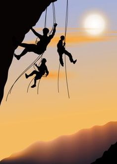 two climbers climbing up the side of a mountain at sunset or sunrise, silhouetted against an orange and blue sky