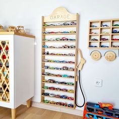 a toy car storage unit in a child's room