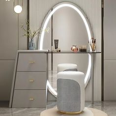 a modern dressing table with an illuminated mirror