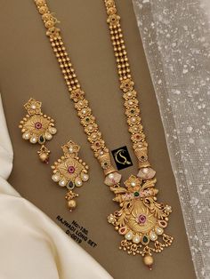 Description :- Indian Traditional Wedding Bridal Wear Gold Plated Necklace Earrings, Wedding Necklace Sets, SouthIndian Traditional Jewelry Set Bridal Wear Gift yourself a royal look with this perfectly crafted necklace set from Manalisstudio. Crafted with high quality CZ stones, it is impressive in design. The green enamel artwork adds perfect texture to the design. Perfect for weddings and festivities, this antique necklace set should be put on with your favorite sari or lehenga. 100% Satisfac Indian Gold Jewellery Design, Wedding Necklace Set, Necklace Set Indian, Indian Jewelry Sets, Antique Necklace, Gold Jewelry Indian, Gold Jewellery Design, Indian Jewellery, Traditional Jewelry