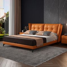 a modern bedroom with an orange leather bed