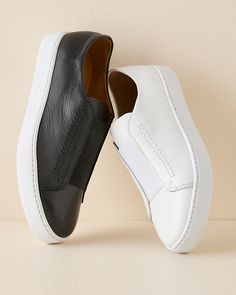 To get you out the door in a flash, our sleek sneaker trades laces for a modern slip-on elastic detail at the vamp. Cobbled for us in Spain of Spanish leather, with a slight wedge heel and padding for comfort.  Exclusive. Slip-on style.  Round toe.  Padded footbed.  1" man-made platform sole.  Spain. Sporty Leather Slip-ons For Streetwear, Modern Low-top Slip-ons, Slip-on Low-top Sneakers, Modern Slip-on Sneakers With Contrast Sole For Spring, Modern Leather Wedge Sneakers With Perforated Toe Box, Modern Slip-ons For Streetwear, Low-top Slip-ons, Modern Slip-on Sneakers With Leather Sole, Modern Low-top Slip-on Sneakers With Contrast Sole