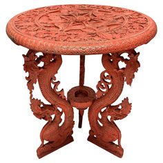 an orange table with carvings on it