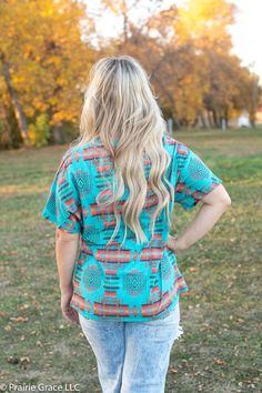 Classic tee gets a little western in this casual beauty! In shades of turquoise and red, this pretty number is perfect for layering or a simple any day tee. 100% Polyester Short Sleeve T-shirt For Vacation In Fall, Fall Vacation T-shirt With Short Sleeves, Turquoise Short Sleeve Tops For Spring, Casual Turquoise Top For Spring, Casual Turquoise Short Sleeve Blouse, Turquoise Casual Summer Tops, Casual Turquoise Tops For Summer, Turquoise Crew Neck T-shirt For Summer, Turquoise Short Sleeve Top For Summer