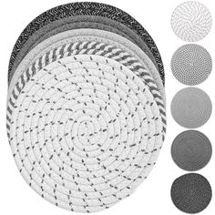 four round rugs with different colors and sizes on the bottom one is black, white, and grey