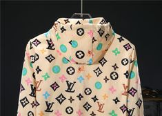 This stylish hoodie is a playful take on the iconic Louis Vuitton style. Featuring a vibrant, multi-colored monogram print on a beige background, it adds a bold touch to any casual outfit. The relaxed fit, drawstring hood, and full-zip closure offer comfort and versatility, while the eye-catching design ensures you'll stand out from the crowd. Louis Vuitton Tracksuit, Vetements Shirt, Louis Vuitton Pattern, Monogram Hoodie, Buy Louis Vuitton, Bottega Veneta Shoulder Bag, Monogram Prints, Bhutan, Beige Background