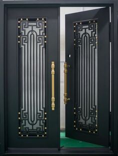 two black doors with gold handles and glass panels