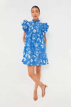 Oliphant's vacation-ready pieces are characterized by breezy silhouettes and vibrant colors.A sweet summer style to wear all season long, the Exclusive Audubon Blue Dress will have you more than ready for all your fun plans ahead. Full of feminine details like ruffled flutter sleeves that add some dimension, pintuck detailing on the yoke, and a swingy hem bringing flowy movement that we can't get enough of, this mini definitely brings out the flirty and romantic. Add sandals and some statement j Chic Smocked Dress With V-neck And Ruffles, Summer V-neck Smocked Dress With Ruffles, Blue V-neck Smocked Dress, V-neck Mini Dress With Smocked Bodice For Beach, Blue V-neck Mini Dress With Smocked Bodice, Plus And Minus, Ruffle Mini Dress, Pin Tucks, Flutter Sleeve