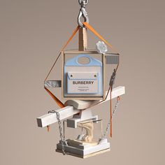 a bird feeder that is shaped like a house and has a blue box on it