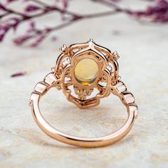 The "Ophelia" ring is an opulent masterpiece, featuring an oval-cut natural opal as its centerpiece, set in 18k rose gold. The intricate design surrounds the luminous opal with sparkling moissanite stones, creating a radiant floral motif. This vintage-inspired yet statement-making ring exudes both elegance and drama, perfect for those seeking a bold yet sophisticated look. "Ophelia" captures the ethereal beauty of nature and the allure of timeless luxury. Flora Ring Design - October Birthstone Ring MAIN STONE Stone: Natural Opal Shape: Oval Cut Color: blue white Measurements: 5x7mm SIDE STONES Moissanite:Round Cut:1.5mm--4 2.0mm--2 2.5mm--2 Marquise Cut:2.0*4.0mm--2 BAND Style: Cluster / Flora Ring / Vintage Ring Material:14k Gold: yellow, white, rose18k Gold: yellow, white, roseOther Meta Luxury Oval Opal Ring With Halo Setting, Elegant Opal Ring With Rose Cut Diamonds, Luxury Rose Gold Opal Ring, Oval Rose Gold Opal Gemstone Ring, Rose Gold Oval Opal Gemstone Ring, Rose Gold Oval Opal Ring, Luxury Rose Gold Opal Gemstone Ring, Heirloom Rose Gold Oval Opal Ring, Gold Opal Ring With Halo Design, Oval Shape