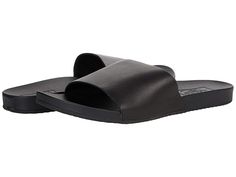 Vans Decon Slide - Women's Shoes : (Leather) Black : Slip into comfort with the Vans Decon Slide featuring a classic slip-on style slide with a well bedded footbed for all day comfort and wear. Available in three color options. Casual slide sandal ready for daily outings. Lightly cushioned footbed. Leather upper and lining. Rubber sole. Imported. Measurements: Weight: 8 oz Product measurements were taken using size 9, width M. Please note that measurements may vary by size. Synthetic Slide Slippers With Leather Footbed, Synthetic Slippers With Leather Footbed, Cushioned Slip-ons For The Beach, Solid Color Synthetic Slides With Textured Footbed, Comfortable Slides With Leather Footbed And Synthetic Material, Casual Slides With Leather Footbed, Comfortable Slides For Everyday Spring Wear, Comfortable Open Toe Slides, Comfortable Everyday Slides For Spring