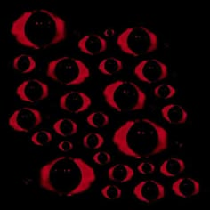 some red circles on a black background