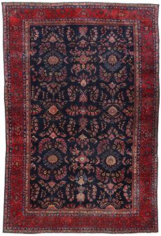 an antique persian rug with red and blue colors