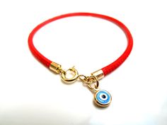 "Kabbalah good luck bracelet 14k gold red string Luxurious bracelet 14k solid Gold beautiful solid yellow 14 k gold and Italian leather bracelet delicate bracelet See description below: * Italian red embroidered leather cord 2.5mm * 14k solid gold and enamel evil eye charm - 6mm - 0.025gr * 14 k solid Gold end caps * 14 solid Gold spring closure *By Symbolina Evil eye: Is a sign of protection that also represents blessings, power, and strength, and is seen as potent in deflecting the evil eye. F Adjustable Bracelet With Gold Clasp For Gifts, Adjustable Yellow Gold Bracelets With Charms, Yellow Gold Charms Bracelet For Good Luck, Yellow Gold Good Luck Charms Bracelets, Handmade 14k Gold Jewelry For Good Luck, Good Luck Charms Bracelet, 14k Gold Jewelry With Gold Clasp For Gift, Yellow Gold Round Jewelry For Blessing, Gold Jewelry With Adjustable Cord For Good Luck