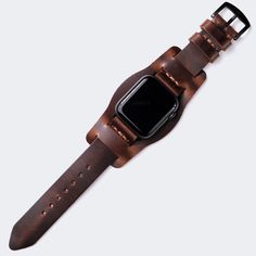 This flat, stitchless design complements the minimal look of Apple Watch series. Single layered leather watch strap with bund piece. Originally crafted for German aviators during WW2, the bund strap features an extra piece of leather within that protects the wearer's wrist from extreme temperatures. When the extra piec Modern Leather Apple Watch Band, Modern Brown Watch Accessories For Everyday, Modern Leather Apple Watch Band For Everyday Use, Modern Leather Watch Accessories With Leather Strap, Brown Leather Watch Band With Adjustable Strap, Minimalist Leather Watch Accessories For Everyday Use, Timeless Adjustable Leather Watch Band, Leather Bracelet With Wrist Strap For Everyday Use, Modern Brown Leather Watch Bands