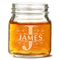 a jar filled with honey sitting on top of a table