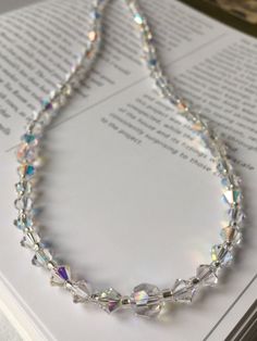 This stunning necklace is ideal for a wedding or evening occasion.  Created using Swarovski crystals, this necklace is the ultimate in elegance. The crystals are clear with an Aurora Borealis coating to create a dazzling shine.  The necklace measures 16 inches in length but can be made longer to suit if you require. It fastens with a silver lobster clasp and a two inch extender chain to allow you to alter the length.  This necklace is also available in a full range of crystal colours. Matching e Dazzling Sparkling Crystal Necklace With Cubic Zirconia, Dazzling Sparkling Cubic Zirconia Crystal Necklace, Dazzling Sparkling Crystal Necklace, Sparkling Crystal Necklace For Anniversary, Crystal Necklaces With Sparkling Stones, Dazzling Crystal Necklaces With Sparkling Stones, Dazzling Crystal Necklace, Sparkling Crystal Rhinestone Necklace For Anniversary, Formal Sparkling Crystal Necklaces