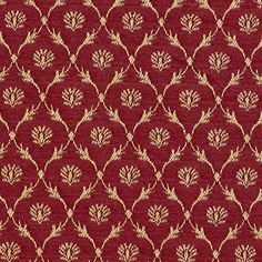 a red and gold fabric with leaves on it