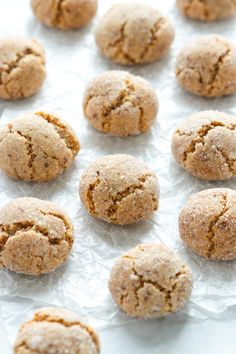 a bunch of cookies that are on some wax paper