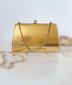 Vintage Evening Golden Clutch Hand Made | 1950's Glamorous Lady's Clutch with Golden Strap | vintage handbag In perfect vintage condition No scratches on top Size: 8" x 5" Retro Rectangular Evening Bag For Vintage Fashion, Vintage Rectangular Evening Bag For Formal Occasions, Vintage Rectangular Evening Bag For Party, Vintage Rectangular Formal Evening Bag, Classic Rectangular Evening Bag For Vintage Events, Retro Rectangular Bag For Events, Vintage Clutch Evening Bag For Events, Vintage Evening Bag For Events, Vintage Rectangular Bag For Events