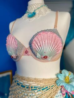 a mannequin wearing a pink and blue bra