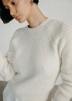 The comfiest pullover, inspired by the fit and ease of a favorite shrunken vintage sweatshirt. Woven in a super soft blend of Alpaca and sustainably grown Organic Pima Cotton in a waffle knit with a slight stretch. Raglan stitch shoulder seaming, ribbed cuffs, neckline and hem. Cozy Textured Knit Cropped Sweater With Relaxed Fit, Cozy Merino Wool Sweater For Everyday, Winter White Crew Neck Cropped Sweater, Relaxed Fit Waffle Knit Sweater, Cozy Cropped Knit Sweater With Crew Neck, Relaxed Fit Waffle Knit Sweater For Winter, Cozy Merino Wool Tops With Ribbed Cuffs, Cozy Merino Wool Textured Knit Top, Cozy Knit Everyday Sweater