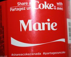 there is a close up view of a bottle of coke with the name marie on it