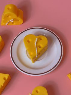 slices of cheese arranged on a plate with one slice cut in the shape of a heart