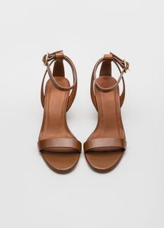 Simply chic - and able to coordinate with everything - our Filene Sandal will be a go to summer favorite.  In black or burnished brown, the mid height heel and sleek straps look perfect with everything from jeans, to a simple sheath dress.  Upper Material: Genuine LeatherOrigin: CN ImportedHeel Height: Med (3cm-5cm)With Platforms: NoOccasion: Dress, Daily, WorkSandal Type: GladiatorHeel Type: Square heelLining Material: LeatherSide Vamp Type: OpenOutsole Material:  LeatherItem Type: SandalClosure Type: Buckle StrapFit: Fits true to size, take your normal sizeBack Counter Type: Ankle StrapAge: 18 - 65, AnyStyle: RomanPattern Type: SolidInsole Material: Pig SplitGender: Women Classic 4-inch Heels For Summer, Classic Evening Sandals With Penny Strap, Chic Brown Sandals With Low Heel, Chic Brown Low Heel Sandals, Elegant Brown Ankle Strap Sandals, Classic Brown Heels With Single Toe Strap, Elegant Brown Sandals With 4-inch Heel, Elegant Brown Ankle Strap Heels, Classic Penny Strap Sandals, Medium Width