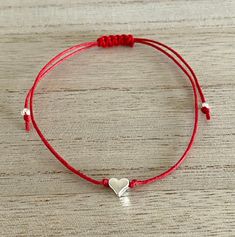 Silver Heart Adjustable Red Cord Bracelet, Gift for Her-Birthday, Anniversary, Christmas, Just because, Red Silver Jewellery, UK Shop Super gorgeous bracelet featuring a cute solid silver plated, nickel and lead free, heart on an adjustable red waxed cotton cord. This adorable bracelet makes a lovely gift for a special loved one. It is sure to put a smile on the recipient's face. The bracelet is 30 cm in length and securely tied with a comfortable sliding knot and is suitable to fit any size wri Adjustable Red Heart Charm Bracelet, Red Heart Charm Bracelet For Friendship, Valentine's Day Heart Bracelet With Sliding Knot, Personalized Red Heart Bracelet, Adjustable Red Heart Friendship Bracelets, Red Heart-shaped Bracelets For Mother's Day, Red Heart Bracelets For Friendship, Red Heart-shaped Bracelets For Valentine's Day, Handmade Heart-shaped Friendship Bracelets For Birthday