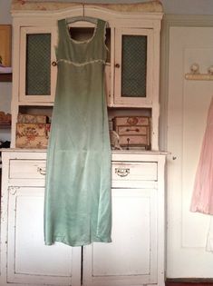 Beautiful strong silk antique nightgown or slip dressin a very special color ; never seen before! bust 33 inches  84 cmarm pit to arm pit 16,5 inches    42 cmhigh waist 14 inches        35,5 cmback length   58 inches    147 cmfrontlengte  54 inches      137 cmin excellent condition.with a repair in both armpits  as shown in a photo