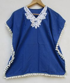 "ITEM DESCRIPTION solid blue summer girls wear kaftan | with side pom pom bohemian kids wear kaftan Fabrics: 100% cotton soft light weight ethnic print fabrics Product: Cotton kids girls woven kaftan in size: 2Y, 3Y, 4Y, 5Y, 6Y, 7Y, 8-9Y & 10-12Y For more sizes & their measurement, please refer our below chart to understand the sizes variations available with us For your size requirement, please mention your size in seller note at the time of buying. Kids Dress For your size requirement, Summer Blue Cotton Kaftan, Traditional Kaftan With Back Tassel Tie-up For Vacation, Traditional Blue Cotton Kaftan, Blue Cotton Kaftan For The Beach, Blue Cotton Kaftan For Vacation, Blue Cotton Kaftan For Beach Cover-up, Blue Cotton Kaftan For Beachwear, Blue Cotton Tunic For The Beach, Blue Cotton Tunic For Beach