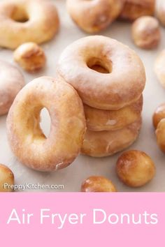 a pile of doughnuts with the words air fryer donuts