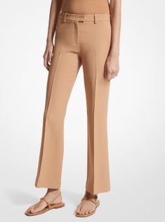 Our coveted Haylee trousers return with a seasonal update for spring. Crafted in Italy from double crepe sablé, this elevated pair is sharply tailored with flared legs and an above-the-ankle hem to create a streamlined silhouette. Finished with side pockets and crisp pleats down the front, they look especially chic paired with sleek sandals and a cashmere sweater or blazer. Fitted Flare Pants With Pressed Crease, Fitted Flare Bottoms With Pressed Crease, Spring Wide Leg Work Pants In Elastane, Chic Spring Dress Pants With Pressed Crease, Spring Formal Elastane Pants, Spring Tailored Elastane Pants, Fitted Wide Leg Elastane Pants For Spring, Spring Formal Fitted Wide Leg Pants, Flare Dress Pants For Business Casual In Spring