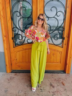 Elevate your style with our "She Stands Out" pants. These high-waisted palazzo pants offer both comfort and airflow, perfect for any occasion. The self-tie in the front and smocked back add a touch of elegance to these vibrant lime-colored pants. Feel confident and stand out in the crowd with our statement piece. Paired with our 'Petal Picking' Top and our 'Work of Art' Top Inseam: 30" Model is 5'1 and has on 3" block heels Green Bottoms With Tie Waist For Loungewear, Green Tie Waist Bottoms For Spring, Green Loungewear Bottoms With Tie Waist, Green Wide Leg Pants For Summer Day Out, Flowy Bottoms For Summer Brunch, Green Wide Leg Pants For Day Out, Chic Spring Wide Leg Pants With Tie Waist, Chic Wide Leg Pants With Tie Waist For Spring, Summer Green Wide Leg Pants For Loungewear