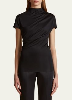 Khaite Zenn Mock-Neck Jersey Top - Bergdorf Goodman Fitted High Neck Blouse, Stretch Elastane Tops For Evening, Elegant Stretch Top With Funnel Neck, Elegant Stretch Funnel Neck Top, Formal Short Sleeve Viscose Tops, Elegant Funnel Neck Stretch Top, Sleek Stretch Top For Formal Occasions, Modern High Neck Tops For Workwear, Modern Stretch Tops For Formal Occasions