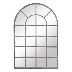 a large arched window mirror on a white wall