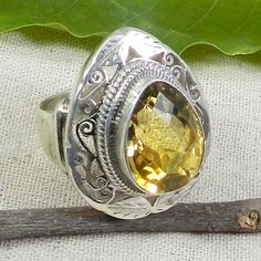 Citrine Ring, Pear Citrine Ring, Wide Band, Band Ring, Designer Ring, Big Ring, Wedding Ring, Charm Ring, Gemstone Ring, Yellow Citrine Ring, Handmade Ring, Women's Jewelry, Gift for Her, 925 Silver Ring. Description : Gemstone : Yellow Citrine Metal : 925 Sterling Silver Stone Size : 16 x 12 MM Approx Stone Shape :- Pear Stamp :- 925 Weight : 13.68 Gram Approx handmade Item **Made to order** This Ring is made to Order. **This ring you will receive may vary from the image as no two gemstones are Citrine Teardrop Wedding Ring, Handmade Pear-shaped Wedding Ring, Teardrop Citrine Ring For Anniversary, Citrine Teardrop Ring For Anniversary, Yellow Citrine Ring, Cats Eye Ring, Yellow Rings, Bezel Set Ring, Jewels Rings