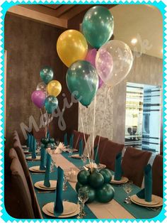 the table is set with balloons and place settings for an elegant dinner or birthday party