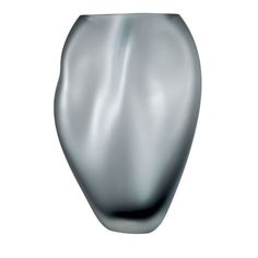 a silver vase sitting on top of a white table