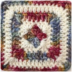 a crocheted square is shown in multicolors