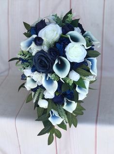 a bridal bouquet with blue and white flowers