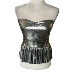 New With The Tag! Adorable Sincerely Jules Metallic Silver Strapless Pleated Crop Top Stretchy Metallic Silver Fabric Sweetheart Neckline Crisscross Striped Pattern Fitted Bodice Waistband Plisse Pleated Peplum Style Hemline Smocked Stretchy Back Cropped There Is A Detachable And Adjustable Strap That Can Be Hooked On For A Halter Look Lined 95% Poly 5% Spandex Size Medium Bust Pit To Pit - 16” Length Without Strap - 15 Tags: Smocked Strapless Metallic Silver Peplum Corset Bustier Fitted Silver Glamorous Tube Top, Glamorous Fitted Silver Tube Top, Metallic Strapless Tube Top For Party, Glamorous Silver Strapless Tube Top, Silver Party Tube Top, Metallic Tube Top For Night Out, Metallic Strapless Tube Top For Night Out, Metallic Fitted Tube Top For Night Out, Metallic Fitted Corset For Party