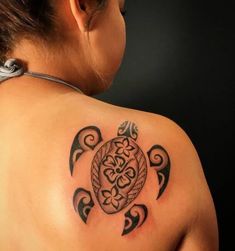 a woman with a turtle tattoo on her back