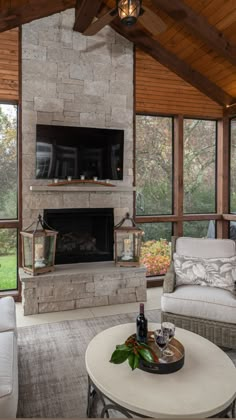 a living room filled with furniture and a fire place